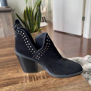 Black heeled ankle boots with studs on the side